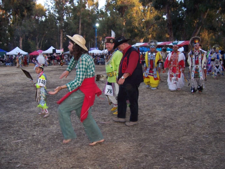 the men are playing on the beach during the festival