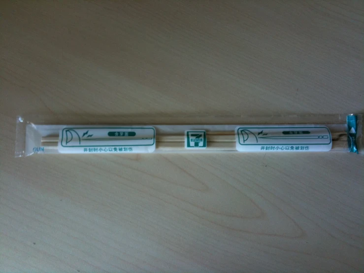 a pair of chopsticks with different sizes of sticks in them