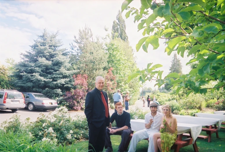 the group is posing for a picture with their guests