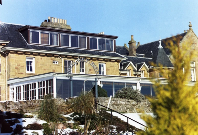 a large building with lots of windows in a snowy area