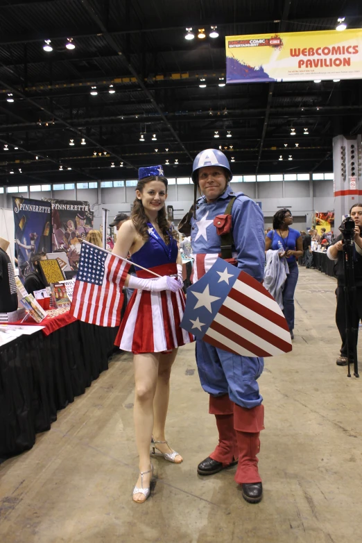 a man and woman standing next to each other at an event