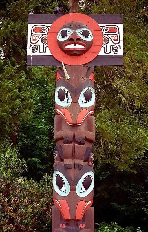 there is an image of a wood totem in the park