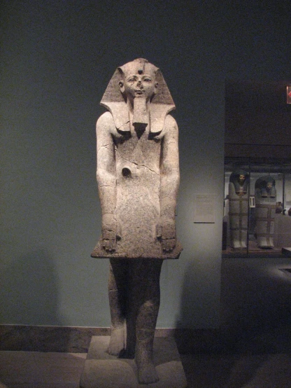 the ancient statue is in a museum