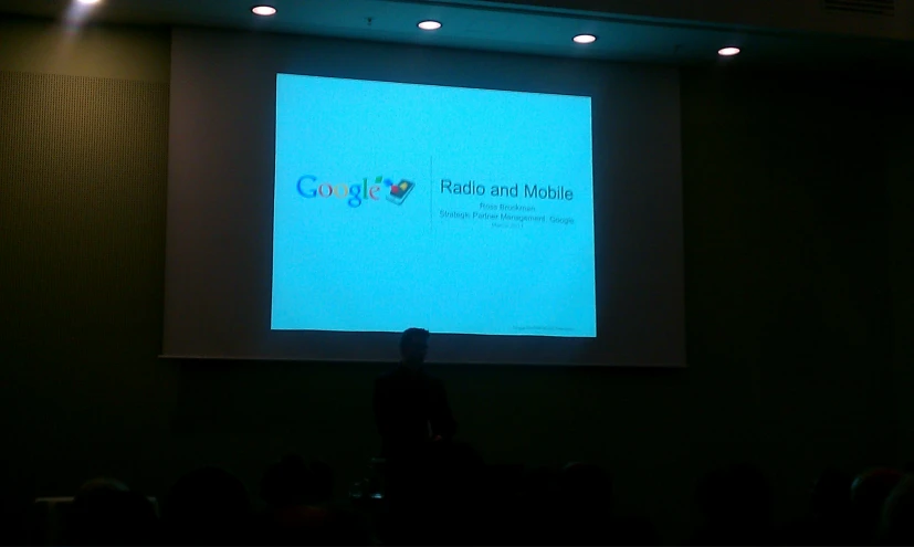 a screen showing the google logo at an event