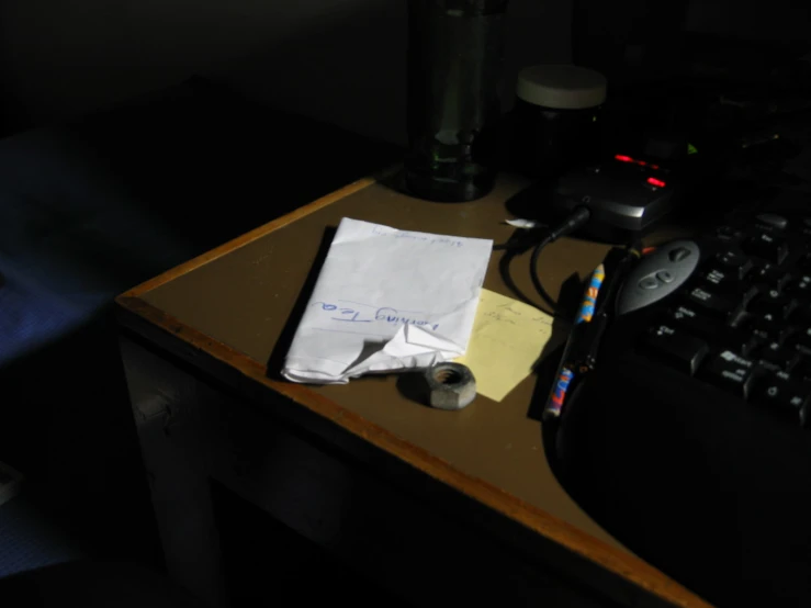 an open note sitting on top of a wooden desk