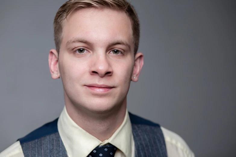 a person wearing a vest and tie