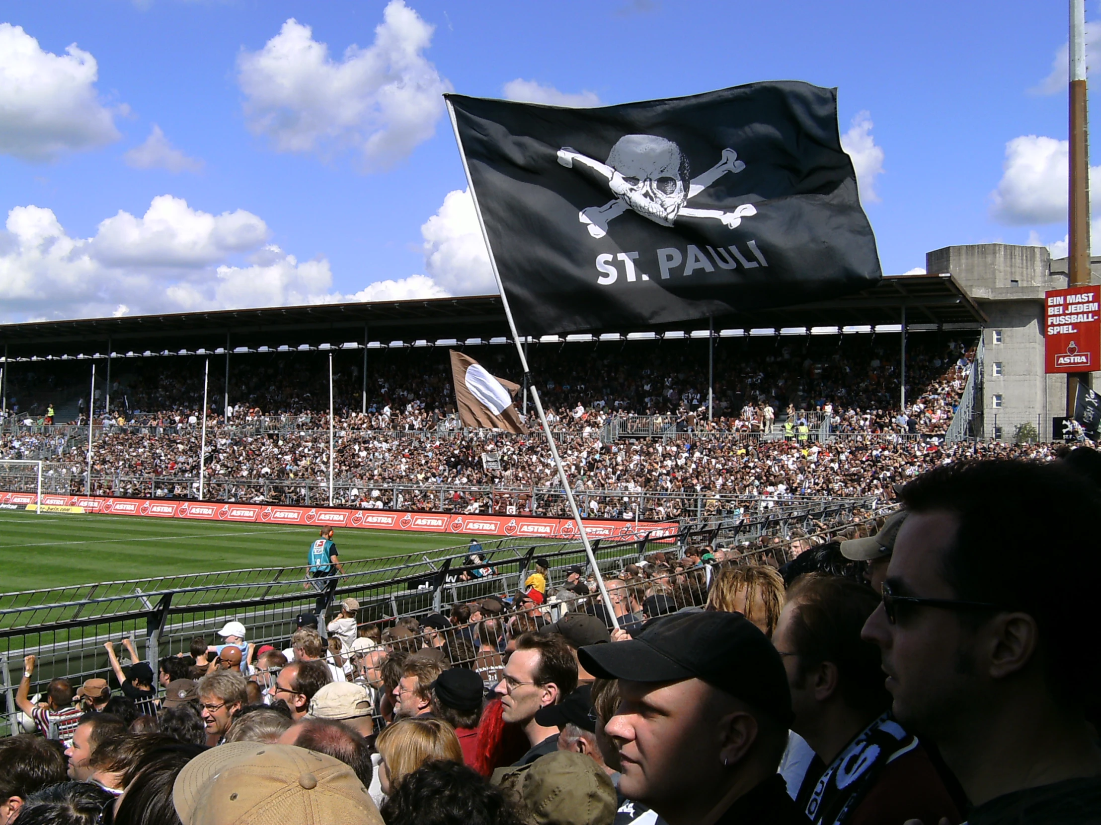 a crowd of people in a stadium at a baseball game