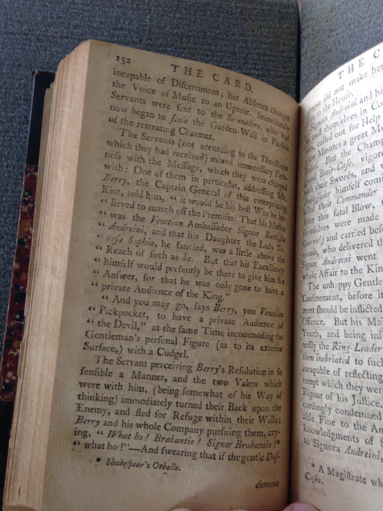 an old open book with handwriting written on it