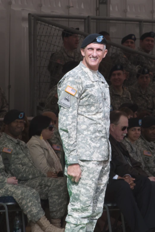 a man in uniform walking down the runway