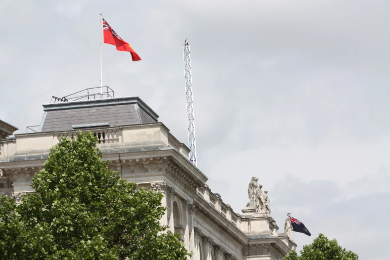 a british flag waving high over a city