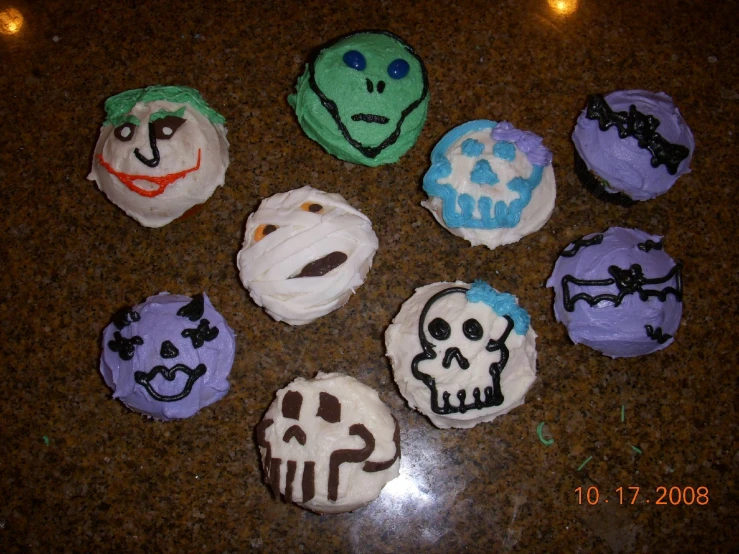 several frosted cupcakes with images of the characters from the movie