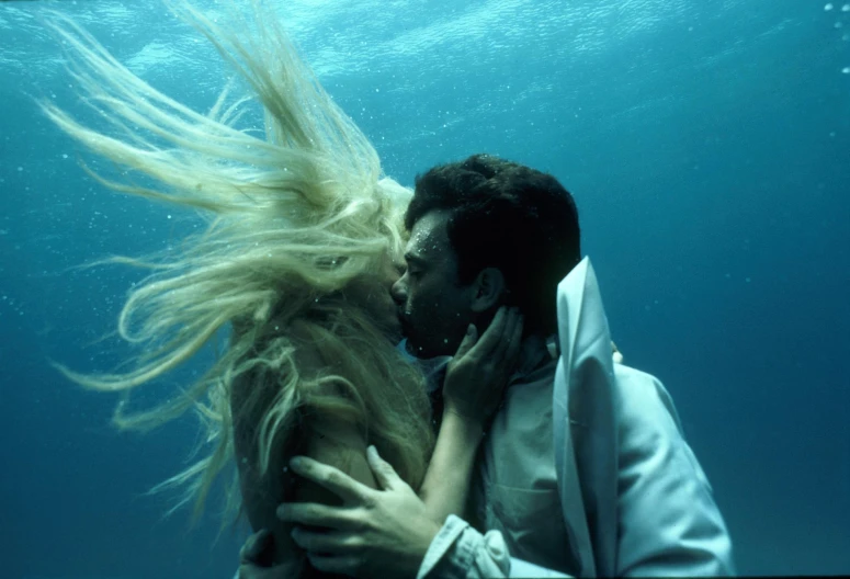 a couple under the water posing together