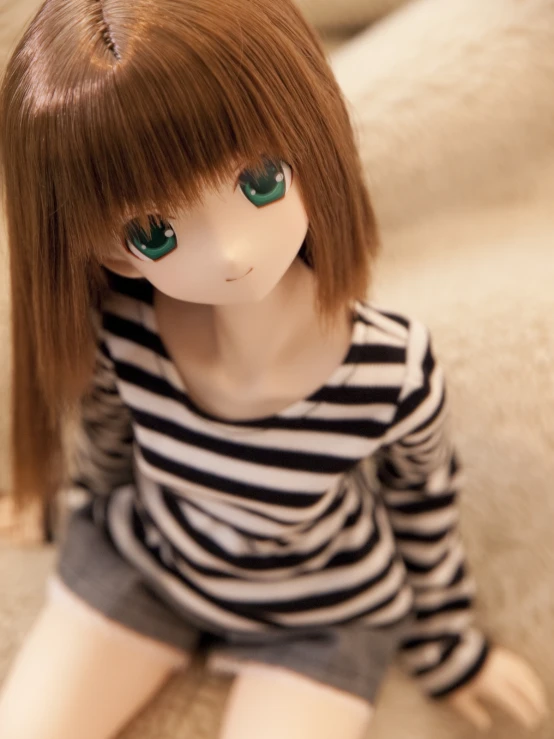 a doll wearing a  shirt and shorts is posed