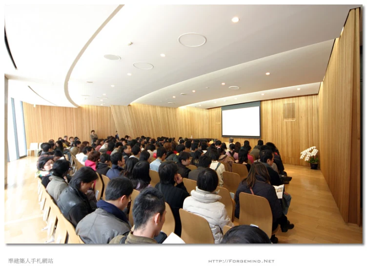 an audience is waiting for the speaker