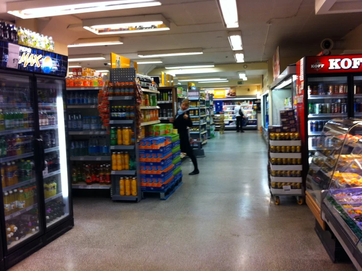 the grocery store with various drinks and goods in it