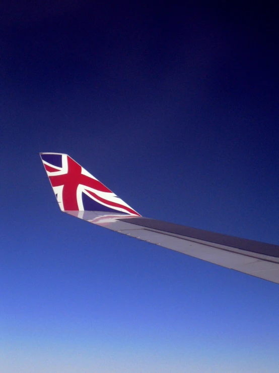 a large airplane wing with the british flag on it