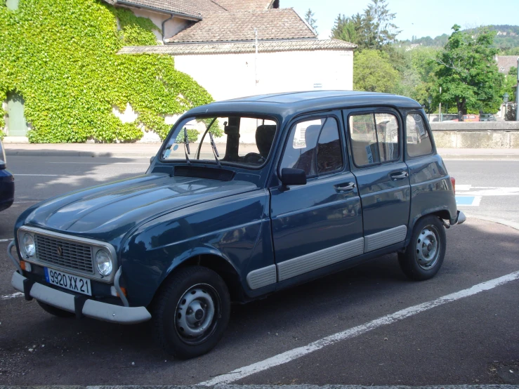 a small van is parked in a spot