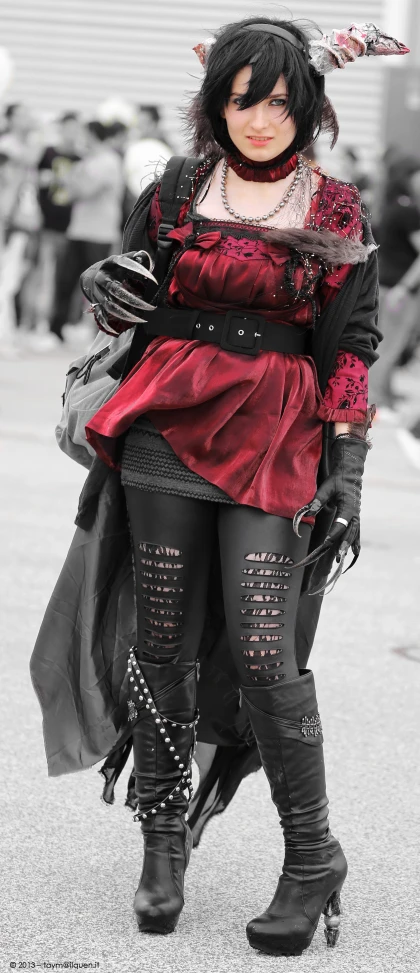 a woman wearing black shoes and red dress