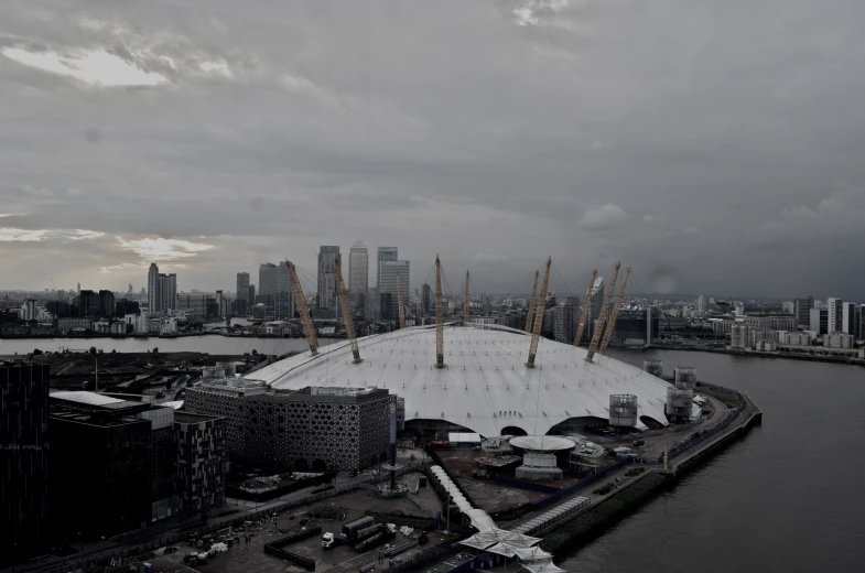 an image of a big city building under cloudy skies