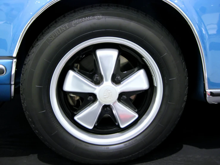 a tire of a blue sports car