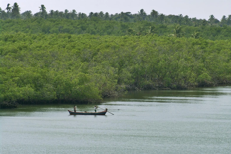 there is a boat with a man in the water