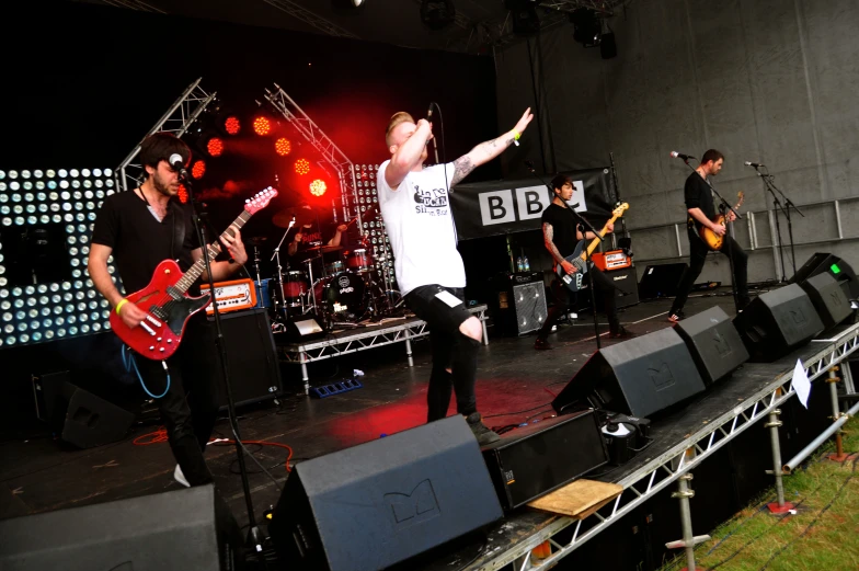 a group of people standing on top of a stage