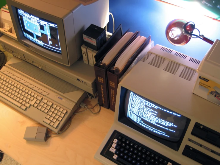 computer desk with laptop, monitor and mouse on it