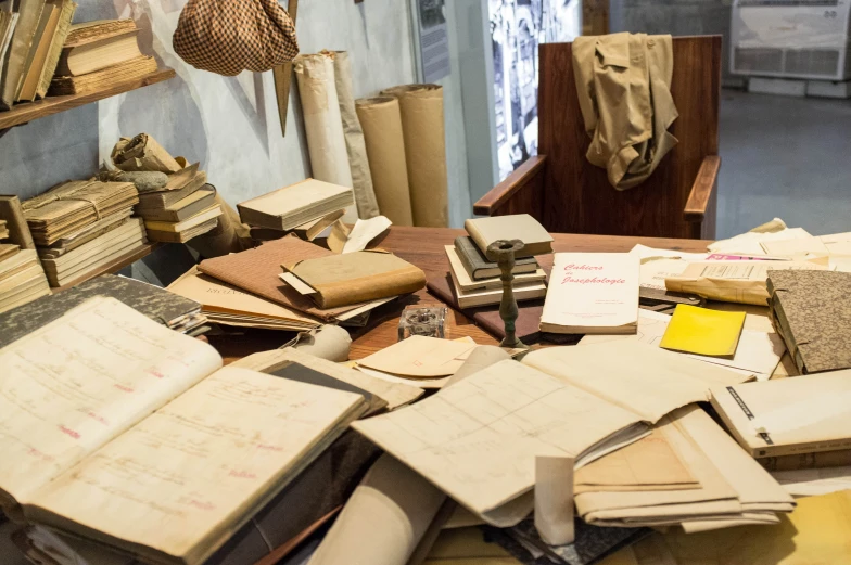 there are many old papers on this table