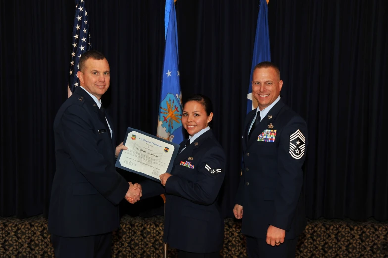 a group of military personnel standing next to each other