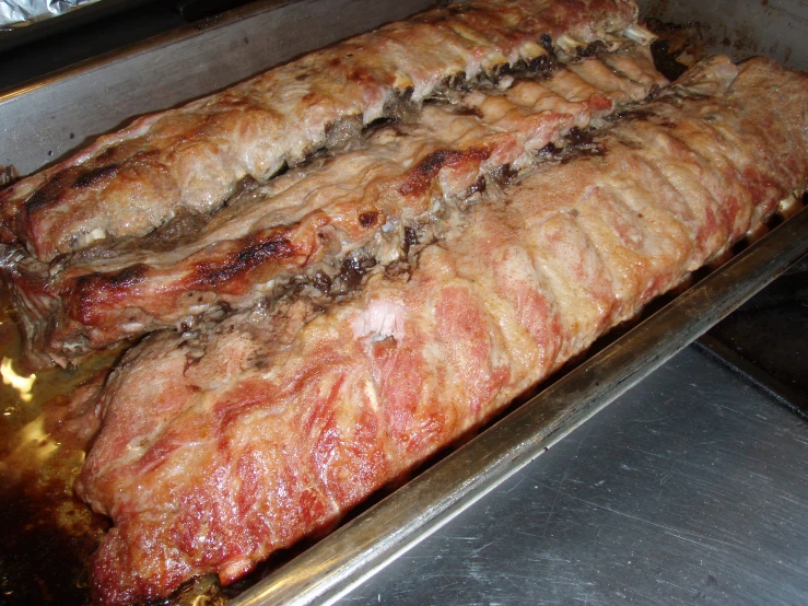 a large meat cooking inside of an oven