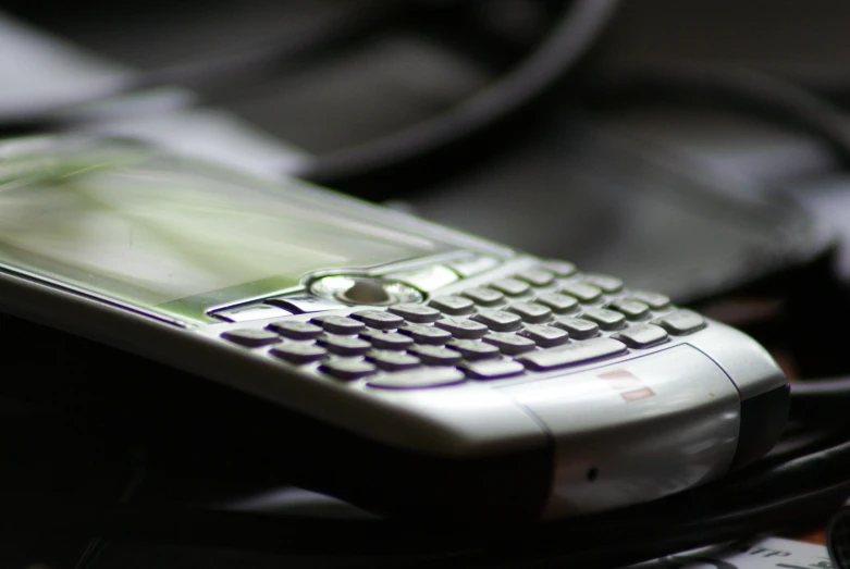 a cell phone with a keyboard on top of it