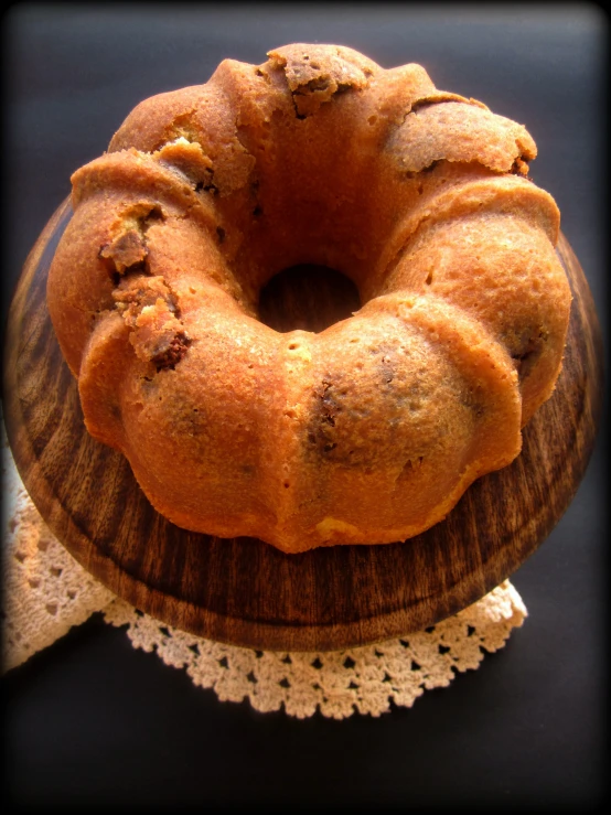 the top half of a bunt cake on a wooden plate