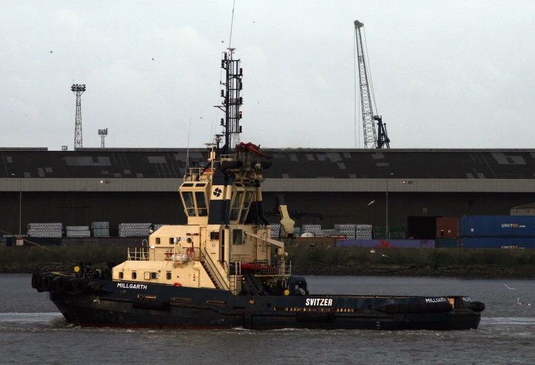 a tug boat that is sitting in the water