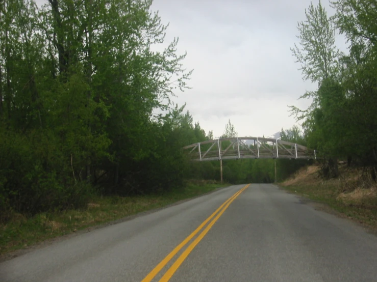 the view of an empty highway and bridge