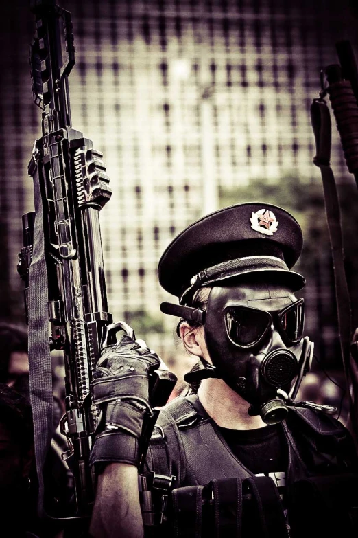 a man in gas mask with a gun