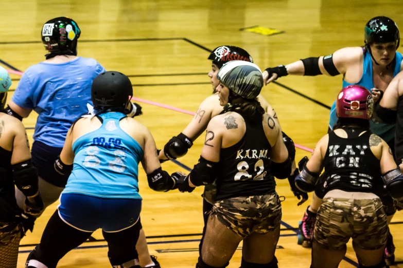 roller derby players gathered together at the court