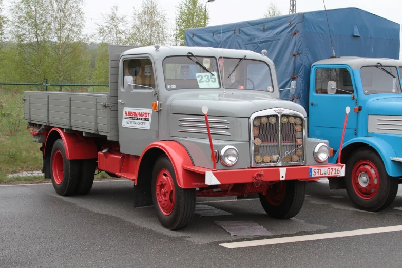 two large trucks are parked side by side