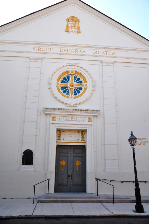 a white church with stained glass front door