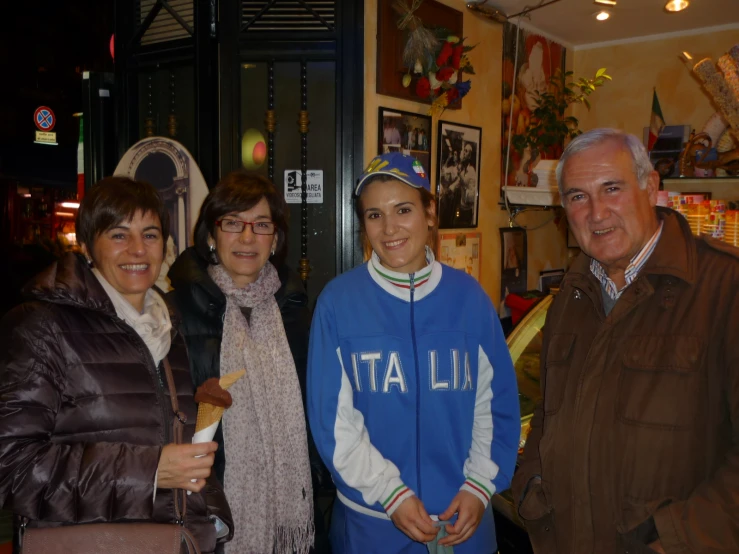 people posing together for a po in a store