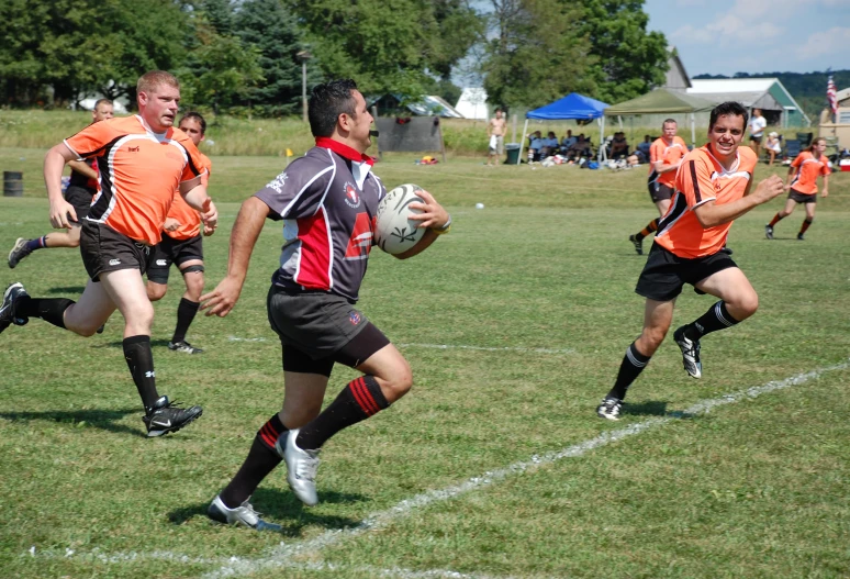 a group of men on the field playing a game