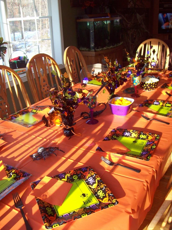 the long table is set up for a halloween celetion