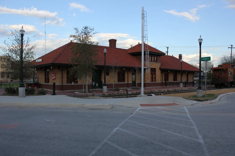 the building is made out of red bricks and has brown roof