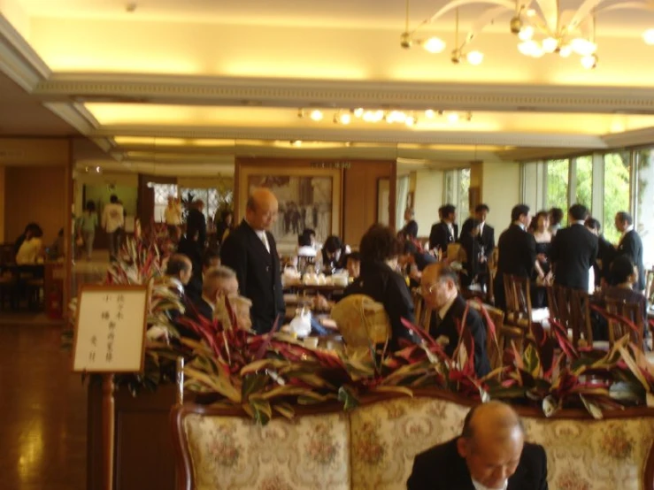 there is an image of a people getting ready to serve at the formal dinner