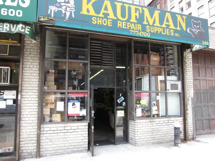 a storefront with a door full of boxes