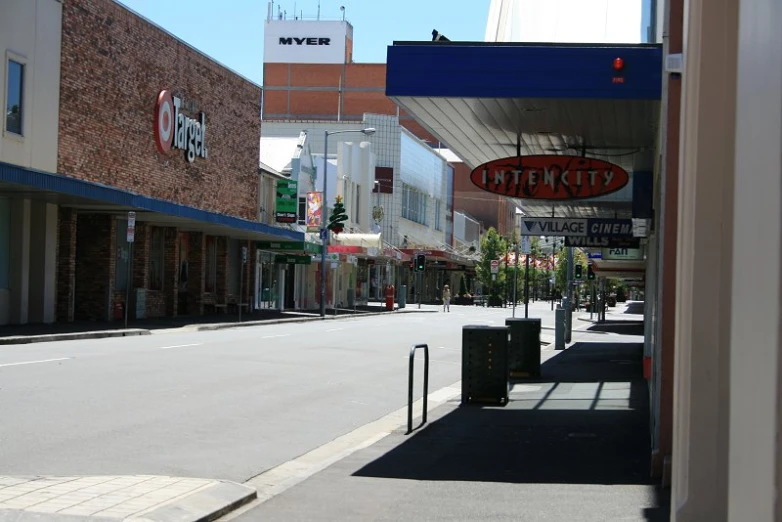 a street that has several shops and buildings on the side