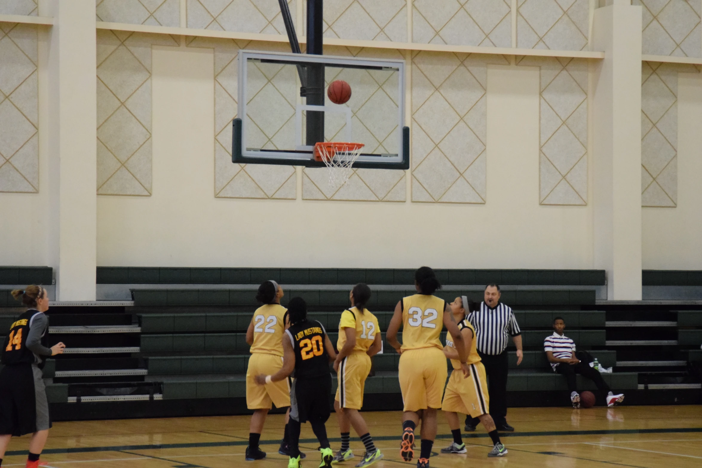 basketball players on court playing a game