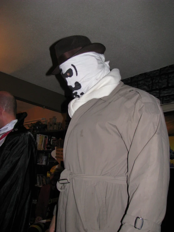 a man is wearing a funny white mask