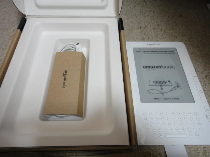 an ipod and the packaging for it in an opened box