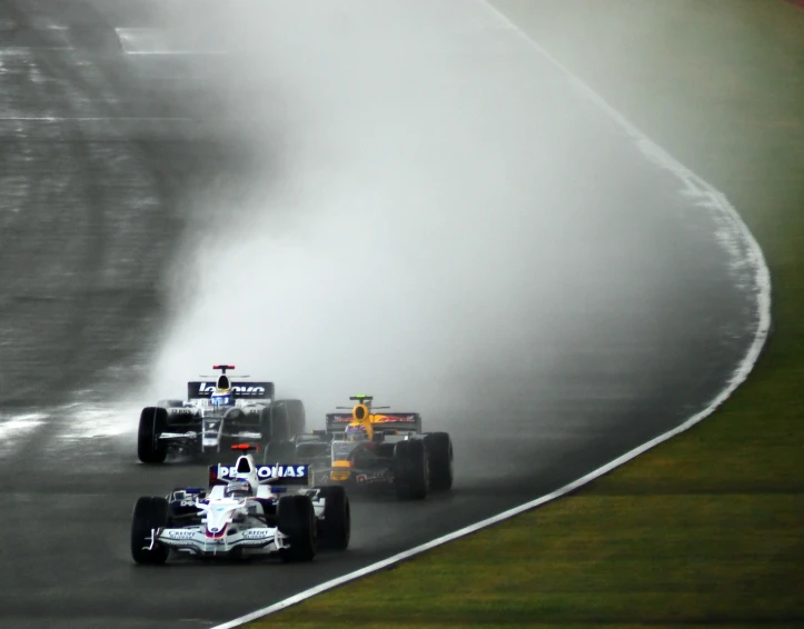 a few race cars racing on a race track