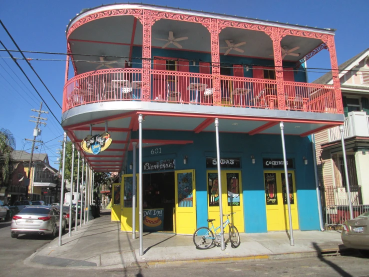 a building on a street corner is red and blue